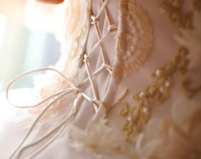 closeup of white wedding dress string